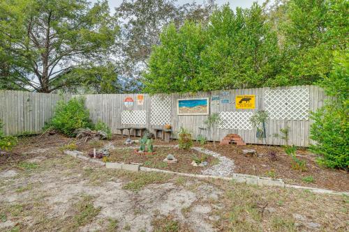 a garden in front of a wooden fence at Pet-Friendly Wilmington Home with Fenced Yard! in Wilmington
