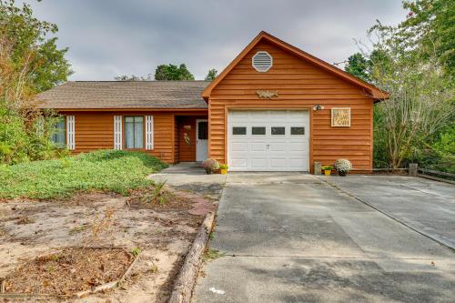 a wooden house with a garage at Pet-Friendly Wilmington Home with Fenced Yard! in Wilmington