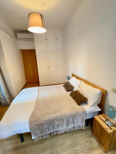 a bedroom with a large bed with white sheets and pillows at Madrid Room Sol Center in Madrid