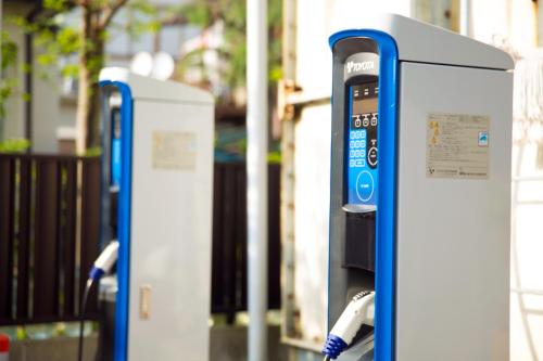a row of parking meters sitting on a street at Hotel Meijiya in Hamamatsu