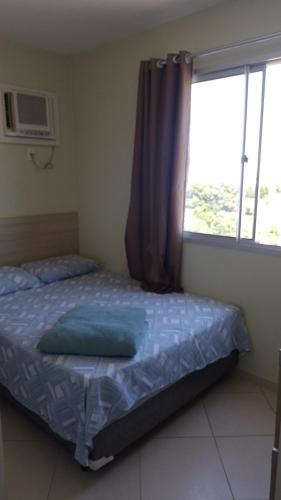 Ένα ή περισσότερα κρεβάτια σε δωμάτιο στο Apartamento em Guarapari