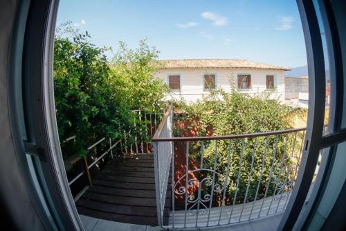 a view from a window of a house with a staircase at Atlantic Pousada in São Sebastião