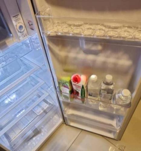 an open refrigerator with its door open andartmentsacersacersacers at diaamond apartment in Lekki Phase 1