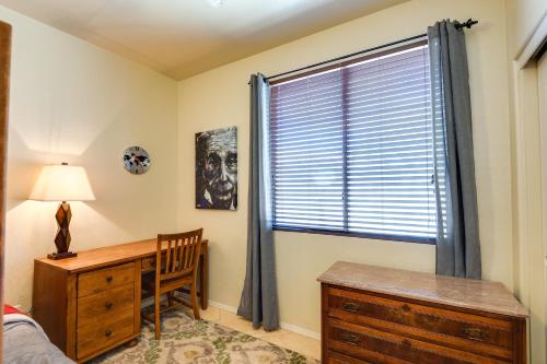 a bedroom with a desk and a window with a dresser at Near Hiking Goodyear Home with Covered Patio in Liberty