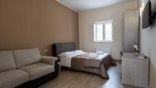 Кровать или кровати в номере Agriturismo MASSERIA QUISISANA