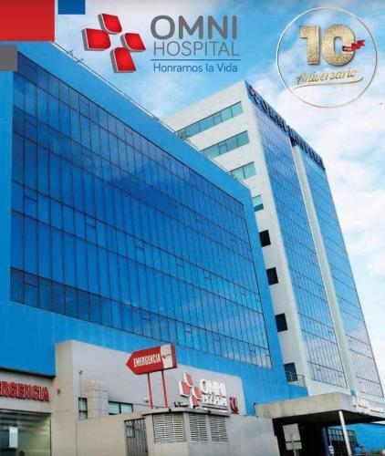 a large building with a sign on the side of it at Ecuabook Wyndham Garden Torre Sol 907 in Guayaquil