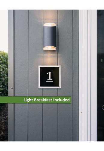 a light on a door with a light breakfast included at Church Lane Accommodation, Milawa. in Milawa