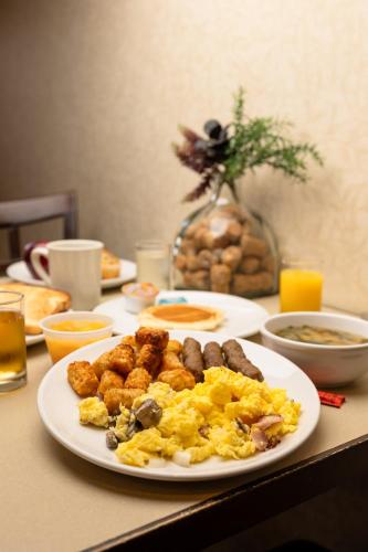 a plate of breakfast food on a table at Maple Tree Inn in Sunnyvale
