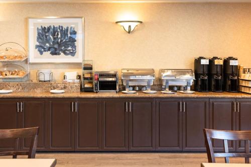 a kitchen with a counter with some food on it at Maple Tree Inn in Sunnyvale