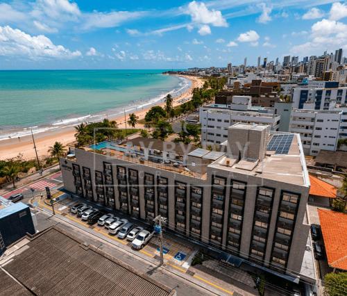 an aerial view of a building and the beach at Arpoar Suítes by Day by Day in João Pessoa