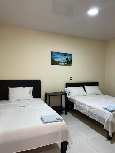 Postel nebo postele na pokoji v ubytování Vanko Hotel