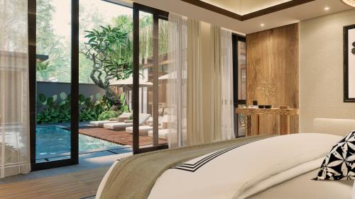 a bedroom with a view of a pool and a bed at The One Boutique Villa & Spa Seminyak in Seminyak
