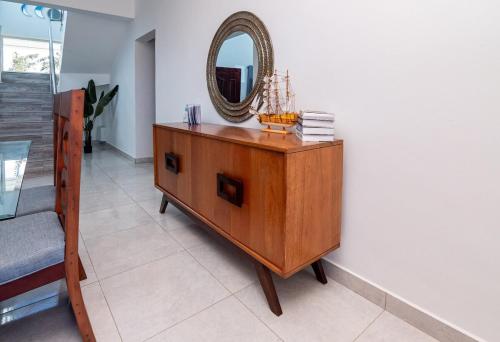 a mirror on top of a dresser in a room at Beautiful ocean and mountain view villa in Gaspar Hernández