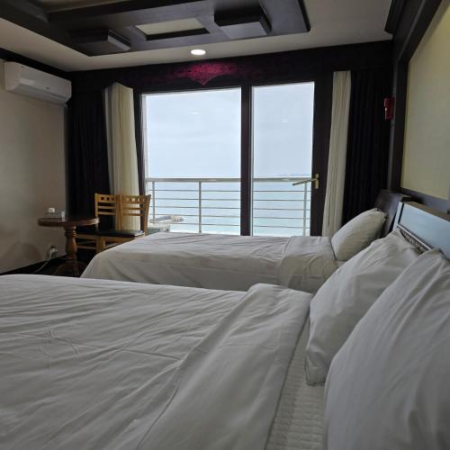 Ένα ή περισσότερα κρεβάτια σε δωμάτιο στο Mobydick Hotel