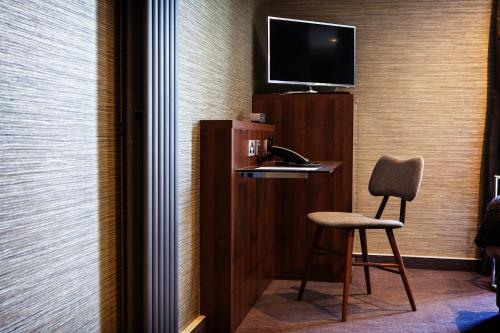 TV a/nebo společenská místnost v ubytování San Pietro Hotel & Restaurant