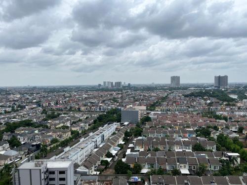 an aerial view of a city with houses and buildings at Mtown Residences Gading Serpong in Pumpangsineng