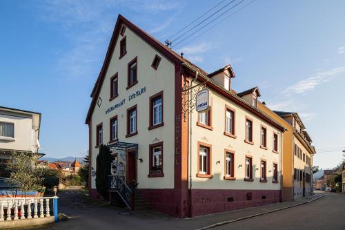 a building on the side of a street at Hotel Restaurant Syrtaki in Gernsbach