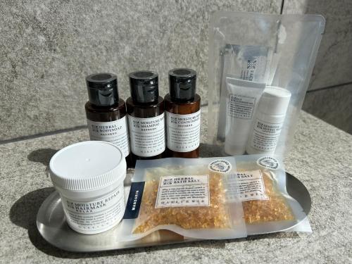 a tray with four bottles of essential oils on a table at lastpiece in Itoshima