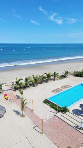 an aerial view of a beach with a swimming pool at Las Hamacas in Canoas De Punta Sal