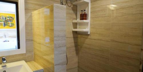 a bathroom with a sink and a shower at Sawasdee House in Bangkok