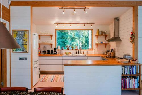 a kitchen with a counter and a window in it at Family House With Large Plot Near The Water in Vätö