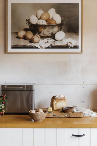 a kitchen counter with a bowl of eggs and a cake at 17pounds Country Estate & Aqua Wellness Retreat in Bullarto