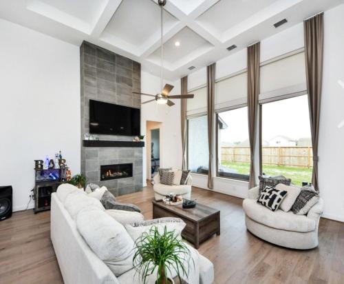 a living room with white furniture and a fireplace at Prívate Room In Cypress in Hot Wells