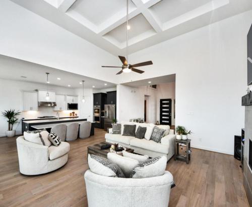 a living room with white furniture and a ceiling fan at Prívate Room In Cypress in Hot Wells