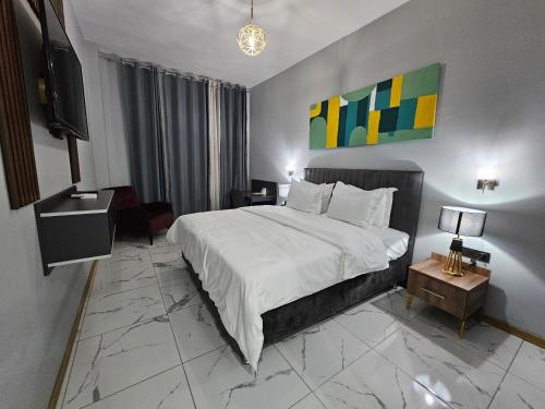 Ein Bett oder Betten in einem Zimmer der Unterkunft Albatros Premium Hôtel