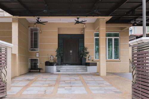 a front porch of a house with a door at Chic 6BR Home Private Rooftop Garden Kemensah KL in Ampang