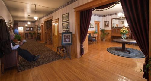 a hallway of a house with a living room at Hôtel Château Albert in Bertrand