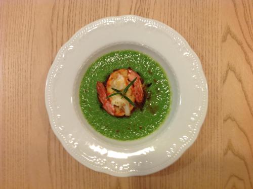 a white plate with a shrimp in a green sauce at Domus Australia in Rome