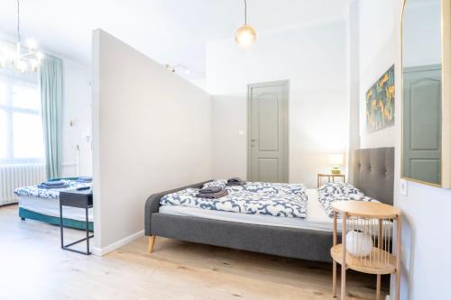 Posteľ alebo postele v izbe v ubytovaní Stylish Broadway Apartment Near Parliament Z30