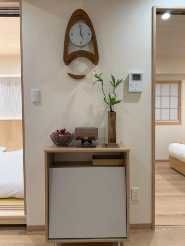 Ένα ή περισσότερα κρεβάτια σε δωμάτιο στο SUN House asakusabashi akihabara tokyo