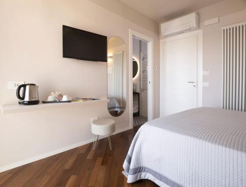 Ένα ή περισσότερα κρεβάτια σε δωμάτιο στο Camere Relais Filomare