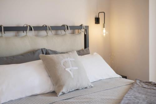 Ένα ή περισσότερα κρεβάτια σε δωμάτιο στο Camere Relais Filomare