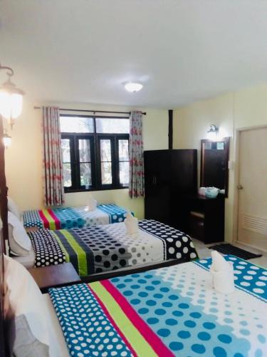 Postel nebo postele na pokoji v ubytování Baan Pak Rim Kuaen Resort
