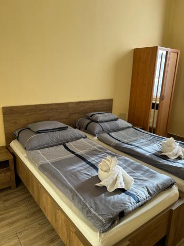 Postel nebo postele na pokoji v ubytování Helga Apartman