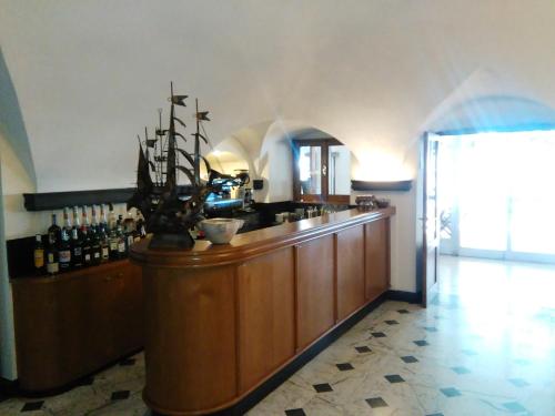 a kitchen with a bar with a counter top at Ristorante Hotel Mira in Sestri Levante