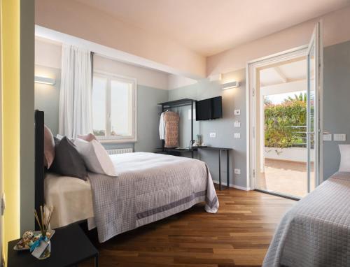Posteľ alebo postele v izbe v ubytovaní bed&breakfast Filomare