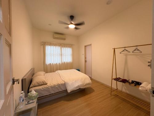 Postel nebo postele na pokoji v ubytování Sunny Hill Homestay
