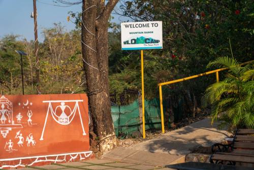 a sign that says welcome to a zoo at Wild Camp- The Nature Resort in Khodāla