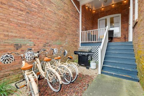 a group of bikes parked next to a brick wall at Mid-Century getaway in Savannah