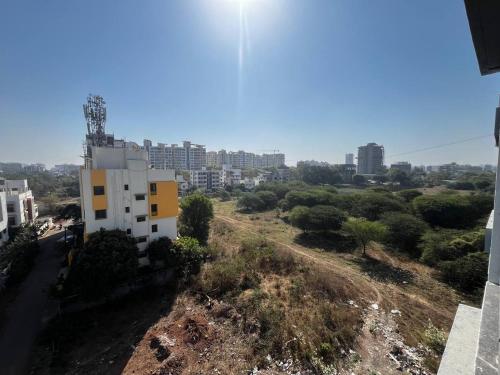 an aerial view of a city with tall buildings at Anahat Host all Back Packer 2BHK 2 Bed AC in Nashik