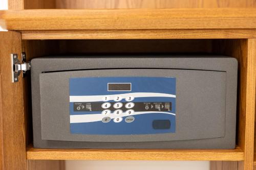 a small television sitting in a wooden cabinet at BeB Domus Arbenzio San Giovanni Suite in Rome