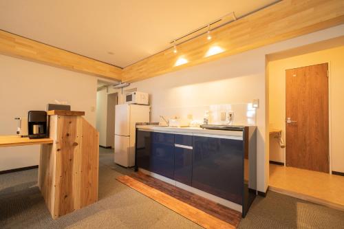 Madarao Vacances Villageにあるキッチンまたは簡易キッチン