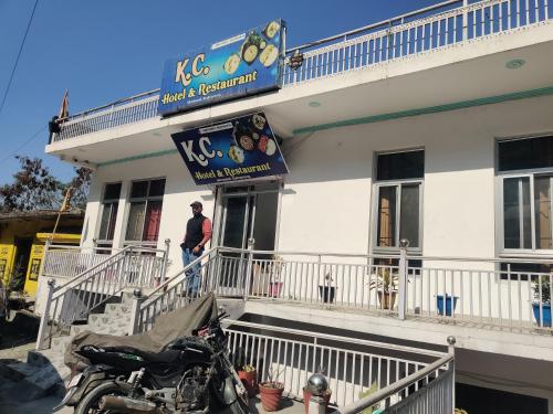 a motorcycle parked in front of a building at KC Hotel & Restaurant in Rudraprayāg