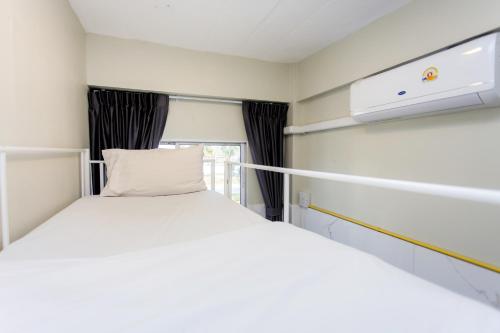 Katil atau katil-katil dalam bilik di Nomad Plus Life Hostel Pattaya