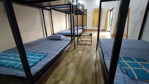 Ένα ή περισσότερα κρεβάτια σε δωμάτιο στο Sim Homestay