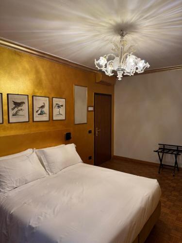 Ένα ή περισσότερα κρεβάτια σε δωμάτιο στο Hotel Guerrato